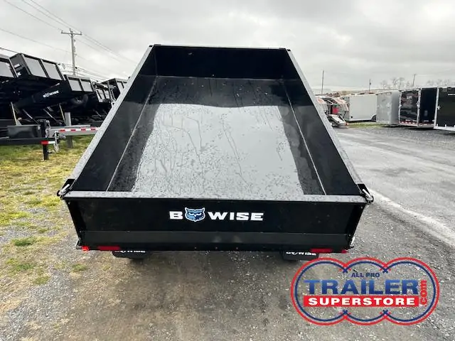 a Bwise dump trailer parked on the side of the road
