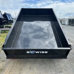 a black Bwise trailer sitting on the side of the road