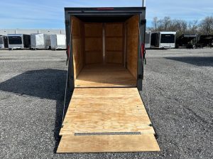 a Homesteader enclosed cargo trailer with the ramp door open