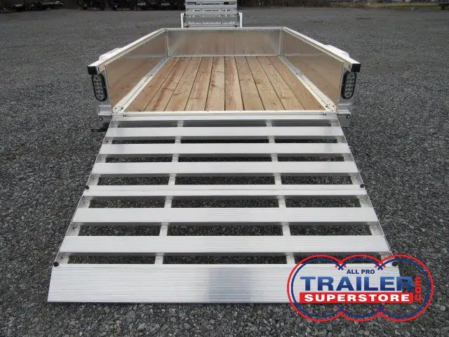 a trailer with a wooden deck and a ramp .