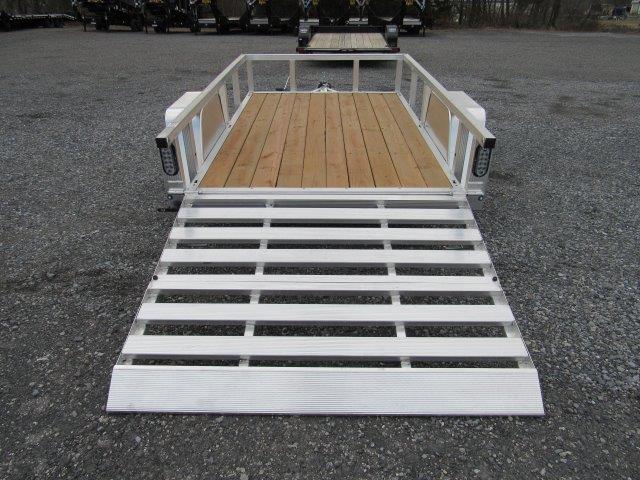 a trailer with a wooden deck and a white ramp