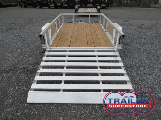 a trailer with a wooden deck and a white ramp