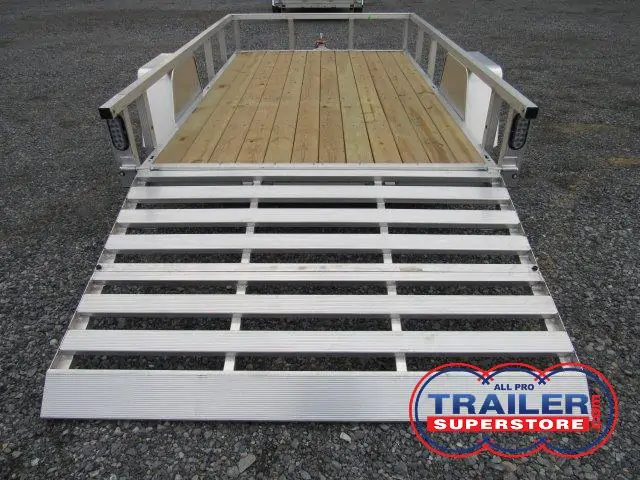 a trailer with a wooden deck and a silver ramp .