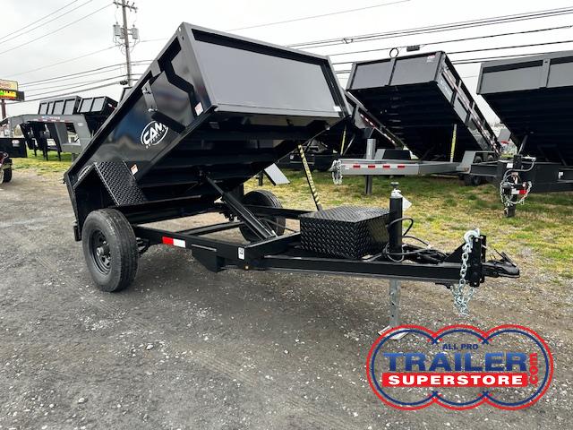 a cam dump trailer on the side of the road
