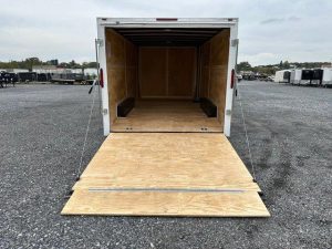 a Homesteader enclosed car trailer with ramp and side doors