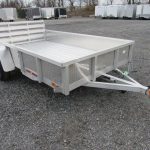 a white Sport Haven landscape utility trailer is parked in a lot