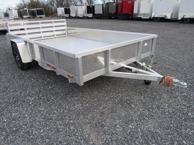 a Sport Haven aluminum landscape utility trailer is parked in a gravel lot
