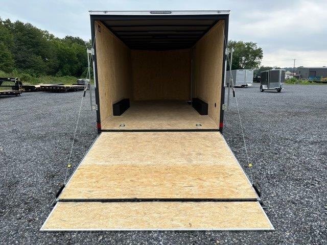 a Covered Wagon trailer with an enclosed V-nose and ramp door