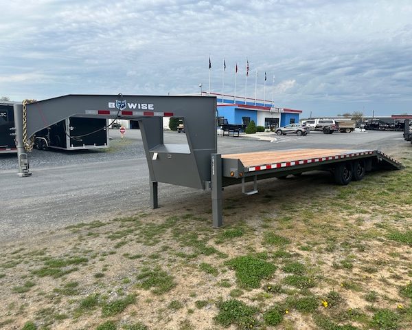 a BWise gooseneck deckover equipment trailer with a hydraulic tail
