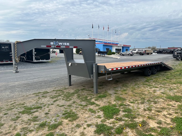 a BWise gooseneck deckover equipment trailer with a hydraulic tail