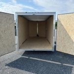 the inside of a trailer with the doors open