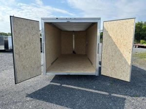 the inside of a trailer with the doors open