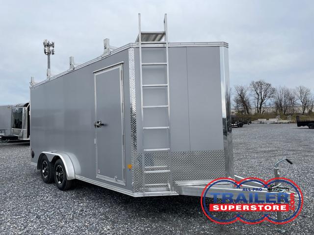 a silver trailer with a ladder attached to it
