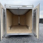 the inside of a Cargo Pro trailer with the doors open in a gravel lot