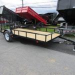 a diamond cargo trailer is parked on the side of the road
