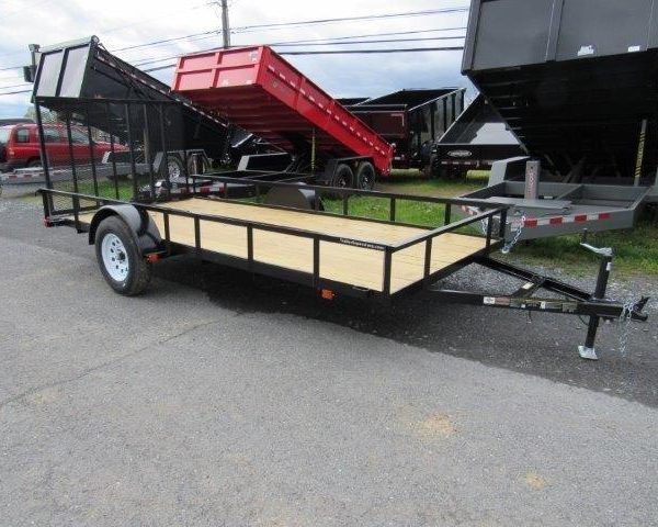 a diamond cargo trailer is parked on the side of the road