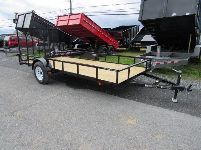 a diamond cargo trailer is parked on the side of the road