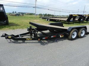 a black trailer parked on the side of the road