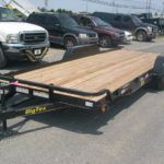 a Big Tex landscape trailer with removable fenders in a parking lot