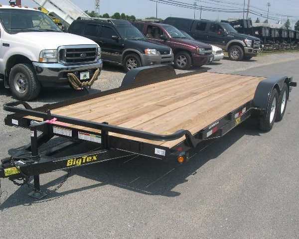 a Big Tex landscape trailer with removable fenders in a parking lot