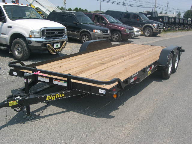 a Big Tex landscape trailer with removable fenders in a parking lot