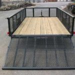 a landscape utility trailer with high mesh sides