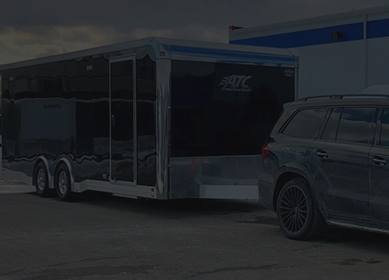 a gray car with an attached ATC trailer