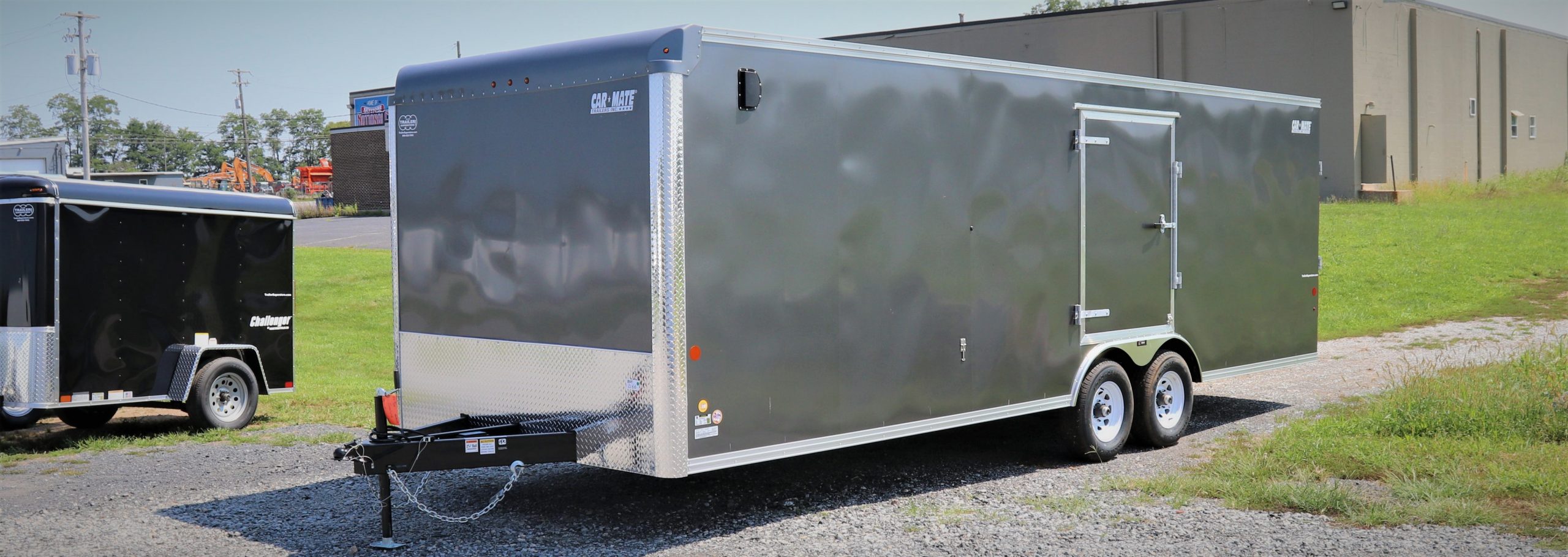 a large gray trailer with the word car mate on it