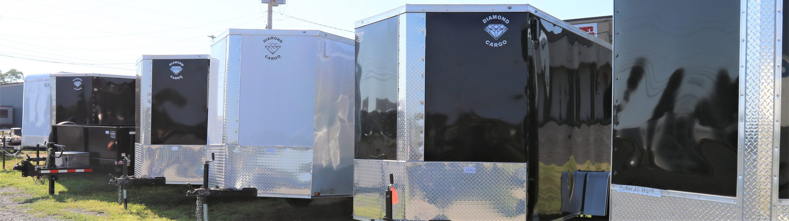 lined up diamond cargo trailer in parking lot