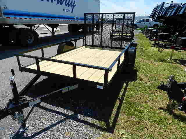 a Premier trailer parked next to a truck