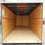 the inside of an empty Homesteader trailer with the door open