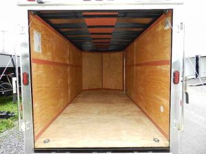 the inside of an empty Homesteader trailer with the door open