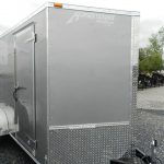 a homesteader trailer is parked in a gravel lot