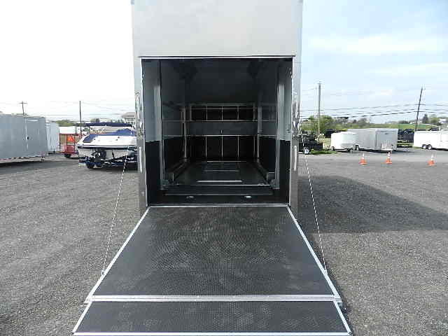 the inside of a trailer with the door open in a parking lot