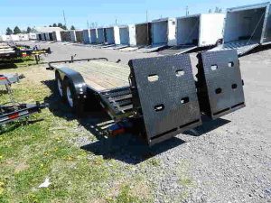 a Big Tex trailer parked next to a row of trailers