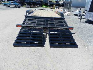 a trailer with a ramp attached to it is parked