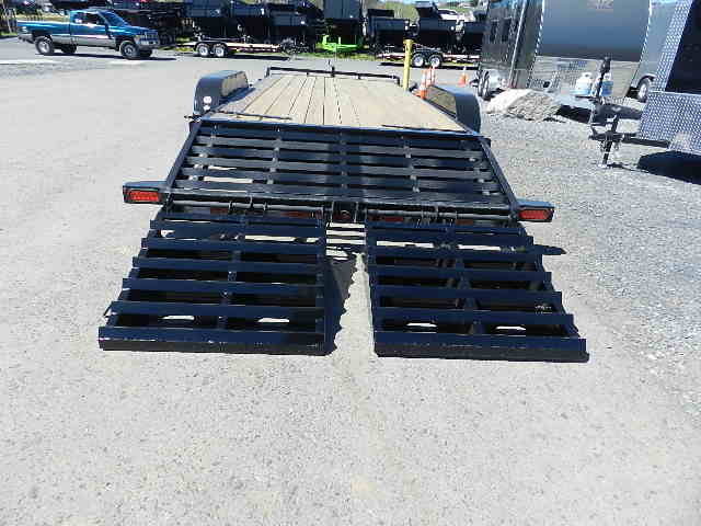 a trailer with a ramp attached to it is parked