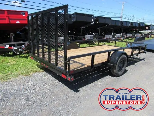 a small trailer is parked on the side of the road .