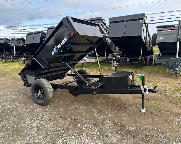a dump trailer with the word be wise on it
