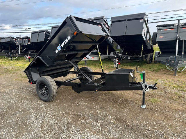 a dump trailer with the word be wise on it