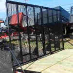 a black metal gate on top of a trailer .