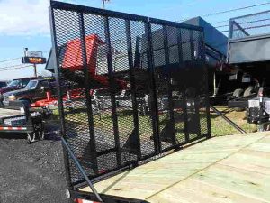 a black metal gate on top of a trailer .