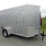a small gray covered wagon with double-rear barn doors