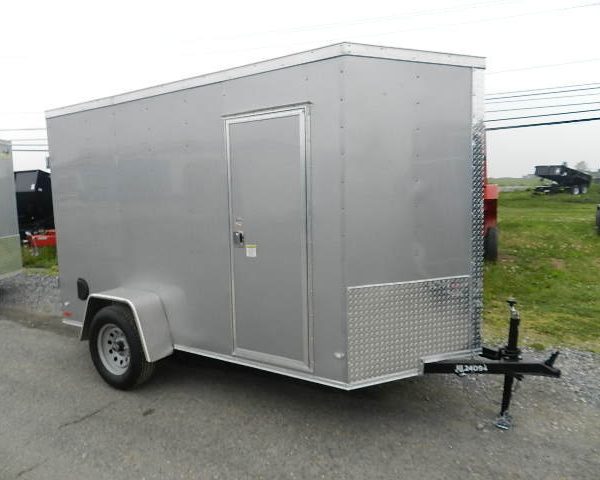 a small gray covered wagon with double-rear barn doors