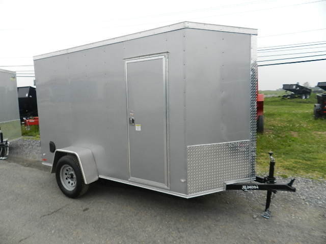 a small gray covered wagon with double-rear barn doors