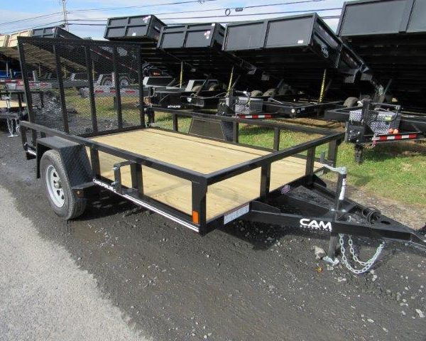 a black trailer with a wooden deck is parked on the side of the road
