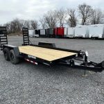 a CAM Superline equipment trailer with ladder ramps