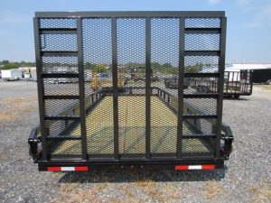 the back of a black trailer with a mesh fence