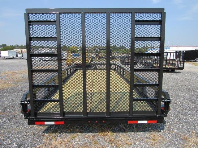 the back of a black trailer with a mesh fence