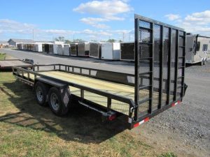 a CAM Superline trailer parked next to a row of trailers